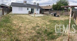 1024 Hazelnut St, Wasco, CA 93280 - rear view of property with a patio area