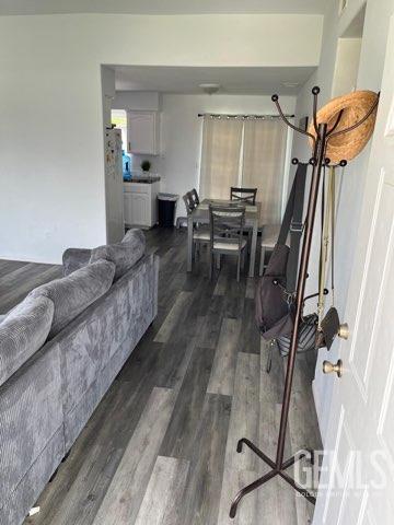 1024 Hazelnut St, Wasco, CA 93280 - living area featuring dark wood finished floors