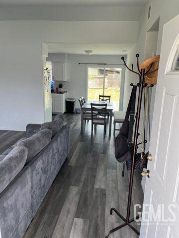 1024 Hazelnut St, Wasco, CA 93280 - living area featuring dark wood-type flooring