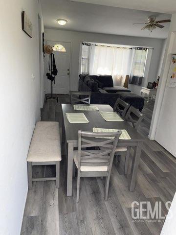 1024 Hazelnut St, Wasco, CA 93280 - dining space with wood finished floors and ceiling fan