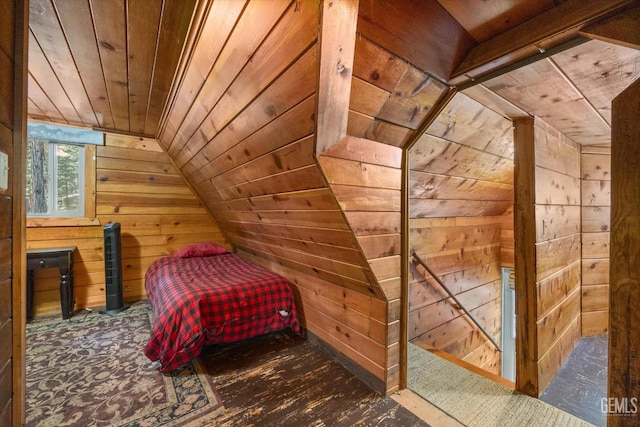 bedroom featuring wooden walls, wooden ceiling, and lofted ceiling