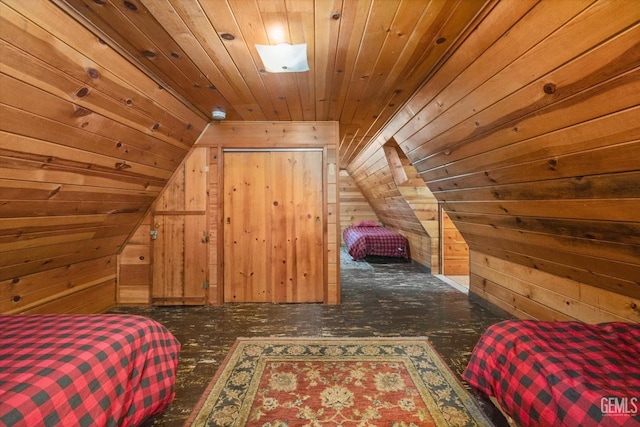 bedroom featuring wooden ceiling and wood walls