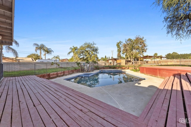 view of swimming pool with a deck