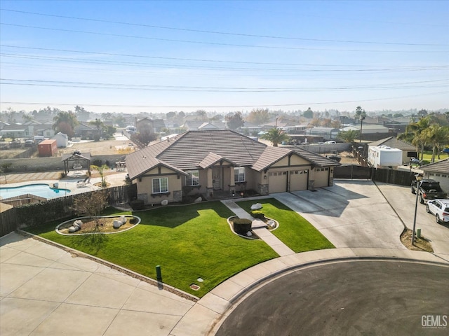 view of front facade featuring a garage and a front lawn