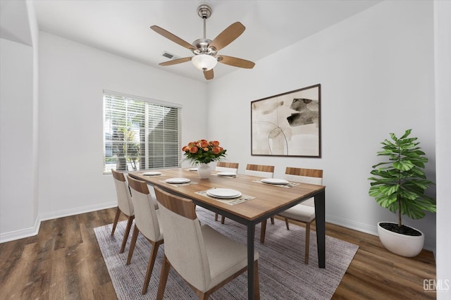 dining space featuring visible vents, wood finished floors, baseboards, and ceiling fan