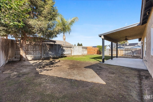 view of yard with a fenced backyard and a patio area