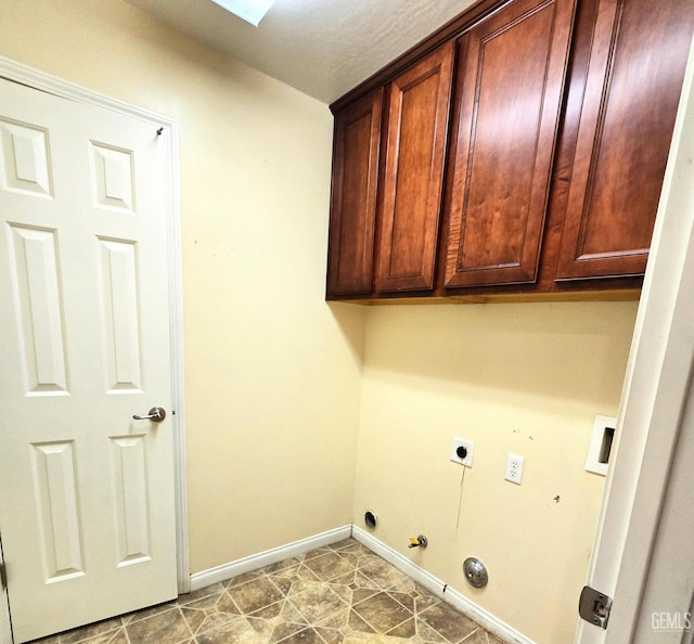 laundry room featuring hookup for a washing machine, cabinet space, hookup for an electric dryer, gas dryer hookup, and baseboards