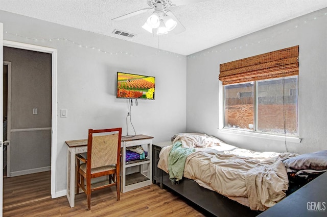 3304 Charlotte St, Bakersfield, CA 93313 - bedroom with wood finished floors, a textured ceiling, and a ceiling fan