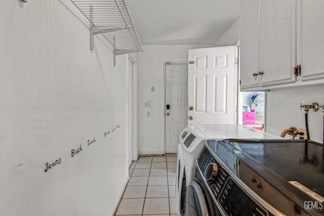 3304 Charlotte St, Bakersfield, CA 93313 - laundry area with washing machine and dryer, cabinet space, and light tile patterned floors