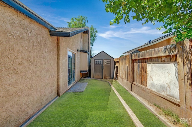 3304 Charlotte St, Bakersfield, CA 93313 - view of yard with a storage unit