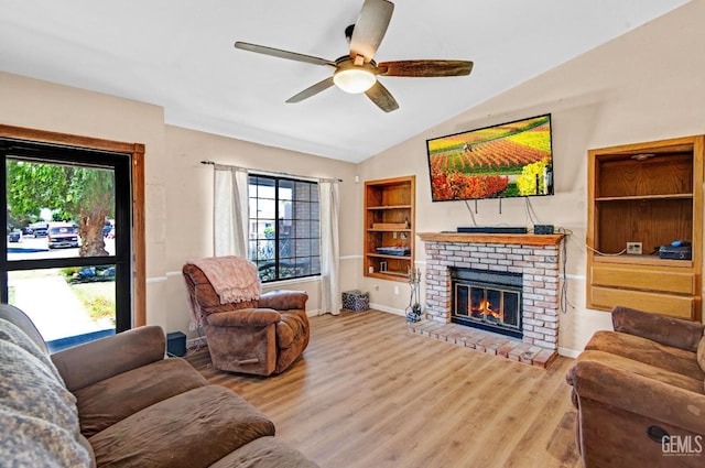 3304 Charlotte St, Bakersfield, CA 93313 - living area with plenty of natural light, wood finished floors, ceiling fan, a fireplace, and lofted ceiling