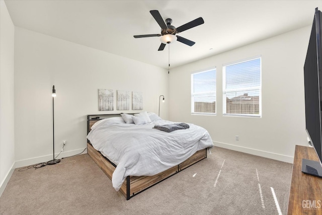 bedroom with baseboards, carpet, and a ceiling fan