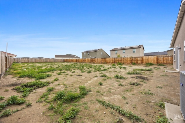 view of yard with a fenced backyard