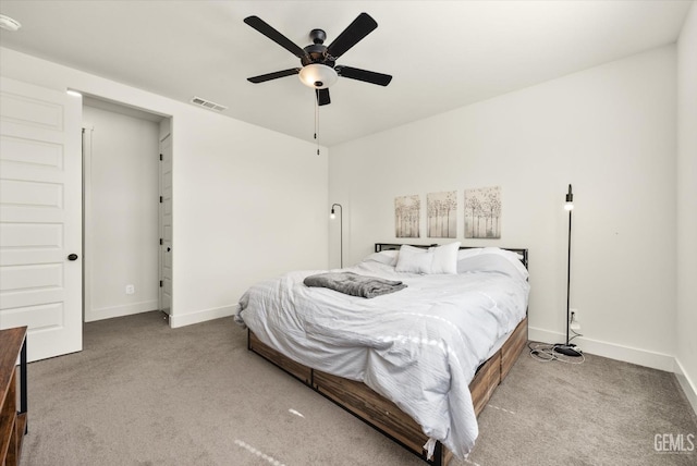 bedroom with visible vents, a ceiling fan, baseboards, and carpet floors