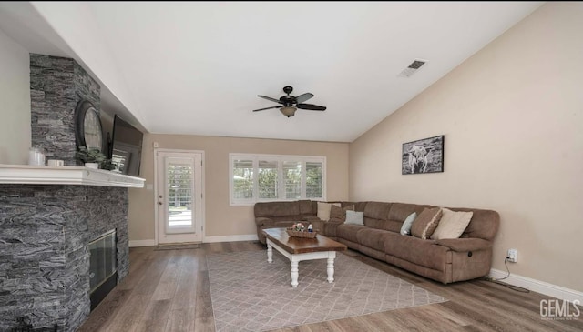 6003 Bluewater Bay Ct, Bakersfield, CA 93312 - living area featuring wood finished floors, ceiling fan, a fireplace, and lofted ceiling