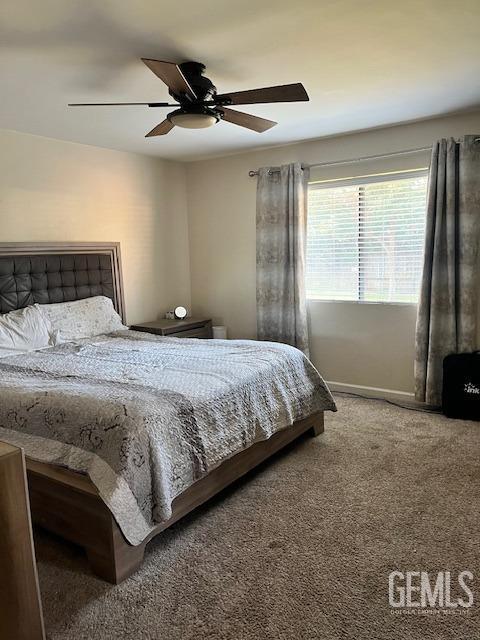 carpeted bedroom featuring ceiling fan