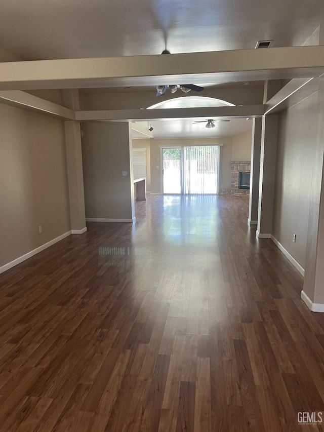 5700 Via Marisol St, Bakersfield, CA 93308 - empty room featuring ceiling fan, dark wood-style flooring, and a glass covered fireplace