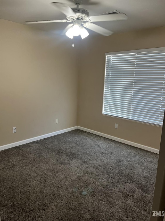 5700 Via Marisol St, Bakersfield, CA 93308 - empty room featuring ceiling fan and dark colored carpet