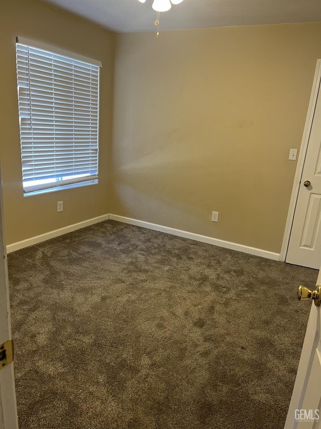 5700 Via Marisol St, Bakersfield, CA 93308 - spare room featuring dark colored carpet and ceiling fan