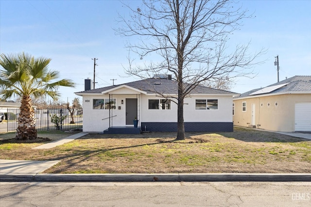 ranch-style house with a front lawn