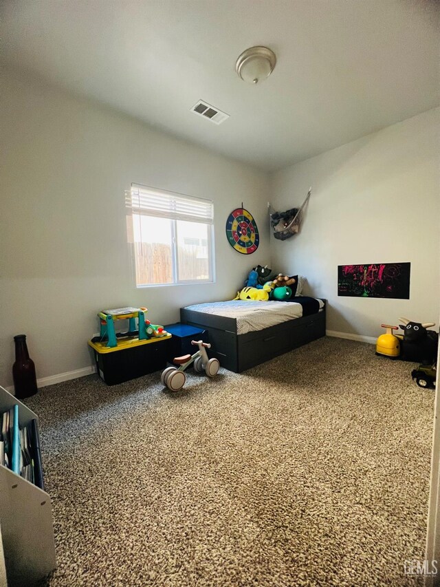 318 Smoke Tree Ct, Wasco, CA 93280 - bedroom with carpet flooring and baseboards