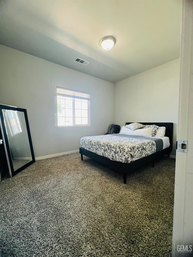 318 Smoke Tree Ct, Wasco, CA 93280 - carpeted bedroom featuring baseboards