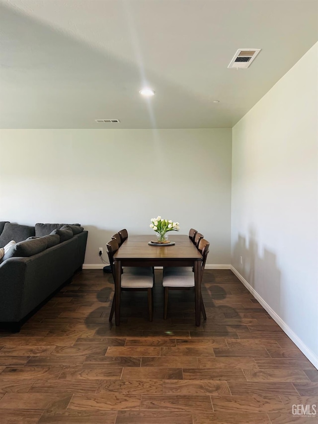 318 Smoke Tree Ct, Wasco, CA 93280 - dining area featuring baseboards and dark wood-type flooring