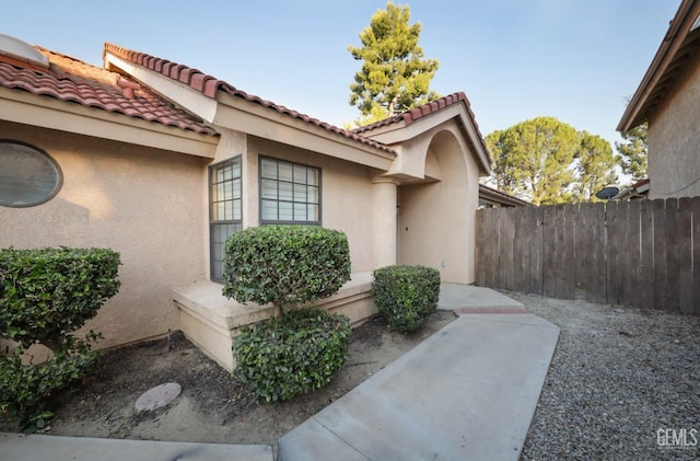 entrance to property with a patio