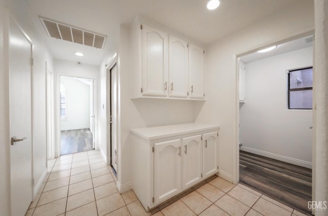 hall with light tile patterned flooring