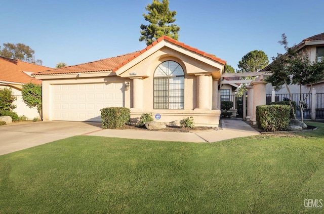 mediterranean / spanish house featuring a front lawn and a garage