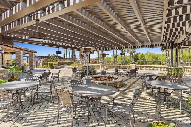 9803 Petersburg Pl, Bakersfield, CA 93306 - view of patio with outdoor dining space, a fire pit, and a pergola