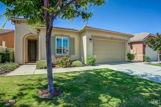 9803 Petersburg Pl, Bakersfield, CA 93306 - mediterranean / spanish-style home featuring stucco siding, a garage, driveway, and a front lawn