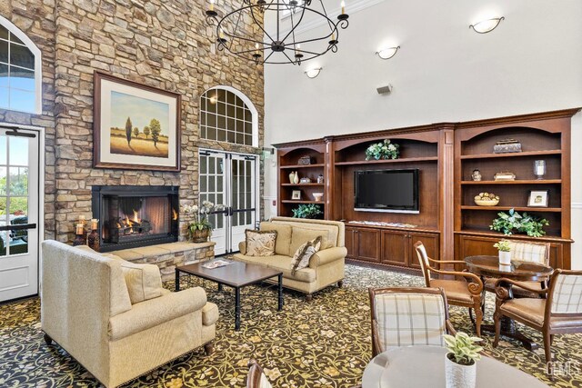 9803 Petersburg Pl, Bakersfield, CA 93306 - carpeted living room with a chandelier, a fireplace, and a towering ceiling