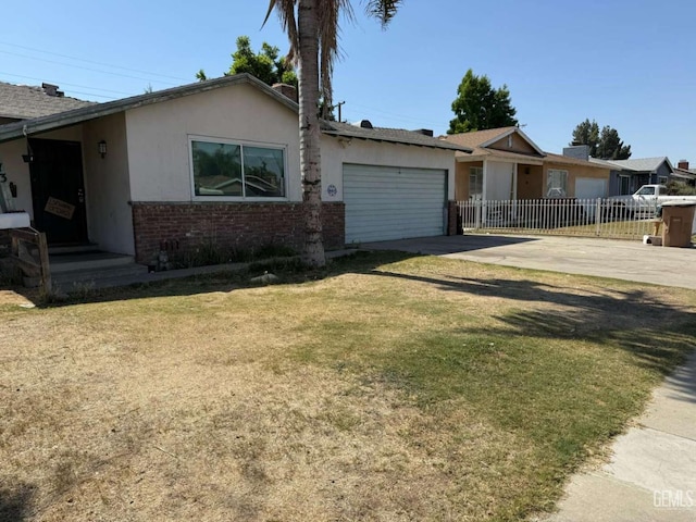113 Easy St, Bakersfield, CA 93308 - ranch-style home with driveway, an attached garage, stucco siding, and brick siding
