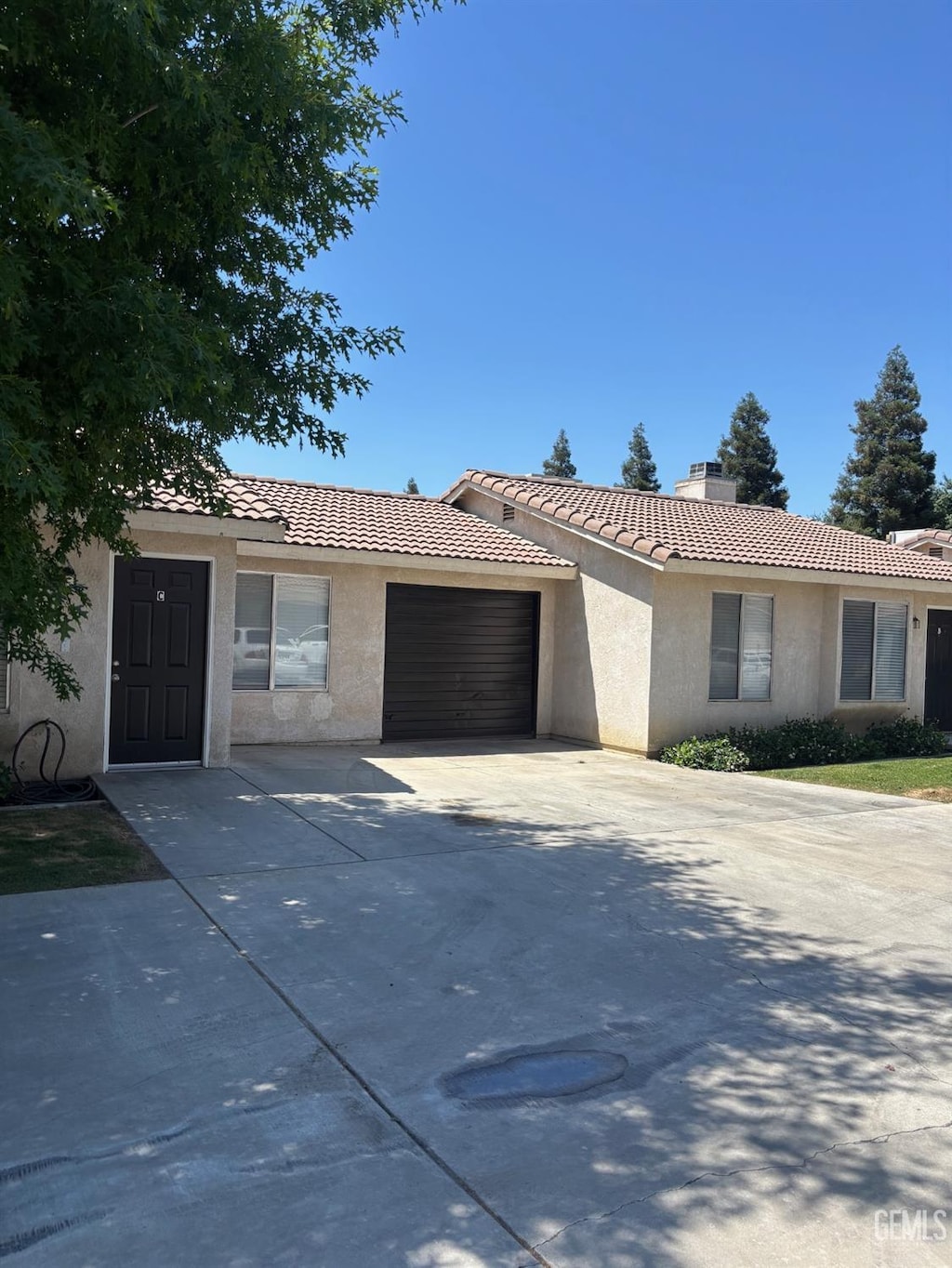 3118 Brookside Dr, Bakersfield, CA 93311 - single story home with an attached garage, a chimney, driveway, and stucco siding