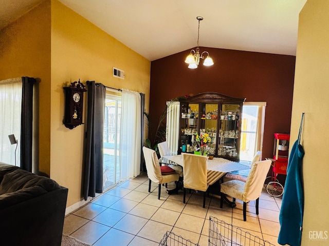 2120 Lamplight Ln, Delano, CA 93215 - dining room with vaulted ceiling, a chandelier, and tile patterned flooring