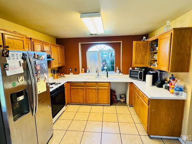 2120 Lamplight Ln, Delano, CA 93215 - kitchen with appliances with stainless steel finishes, a sink, brown cabinets, open shelves, and light tile patterned floors