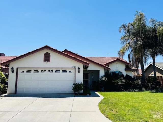 2120 Lamplight Ln, Delano, CA 93215 - view of front of home with stucco siding, a garage, concrete driveway, a tile roof, and a front lawn