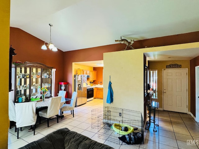 2120 Lamplight Ln, Delano, CA 93215 - dining room featuring light tile patterned floors, lofted ceiling, and a chandelier