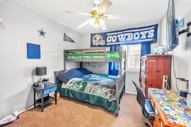 bedroom featuring baseboards, a ceiling fan, and carpet