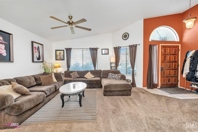 carpeted living room featuring lofted ceiling, a healthy amount of sunlight, and a ceiling fan