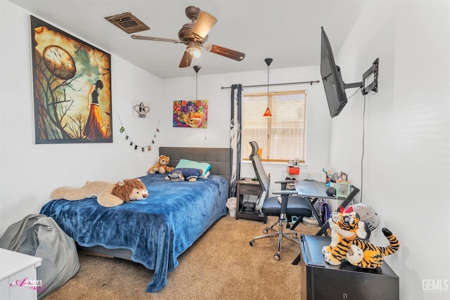 bedroom with visible vents, carpet, and ceiling fan