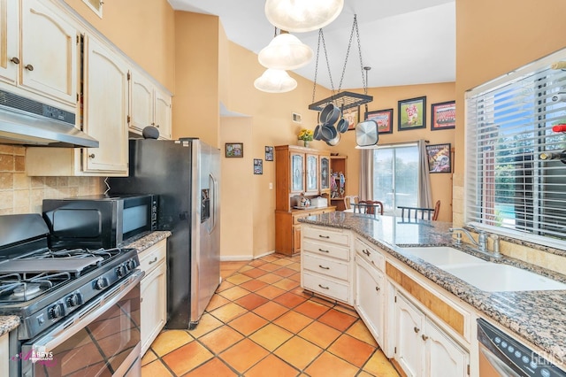 kitchen with under cabinet range hood, decorative backsplash, light tile patterned flooring, stainless steel appliances, and a sink