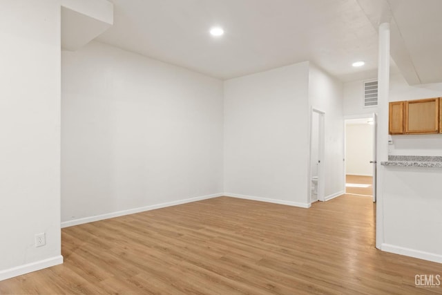 unfurnished room with light hardwood / wood-style flooring