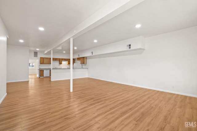 basement featuring light hardwood / wood-style floors