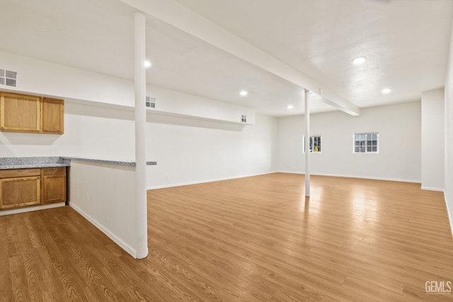 basement with light wood-type flooring