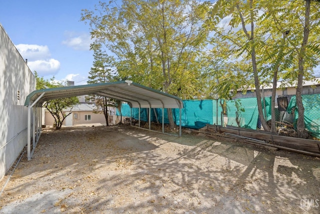 view of vehicle parking featuring a carport