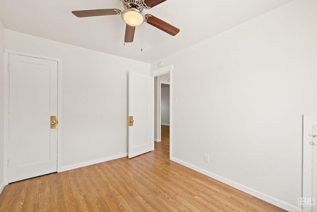 unfurnished bedroom featuring ceiling fan and light hardwood / wood-style flooring