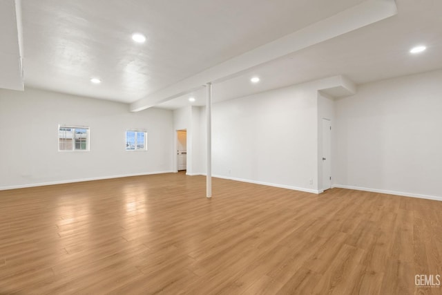 basement with light hardwood / wood-style floors