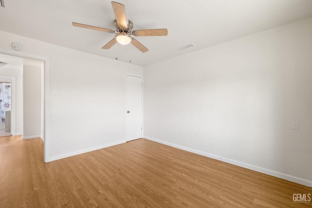 unfurnished room featuring ceiling fan and light wood-type flooring